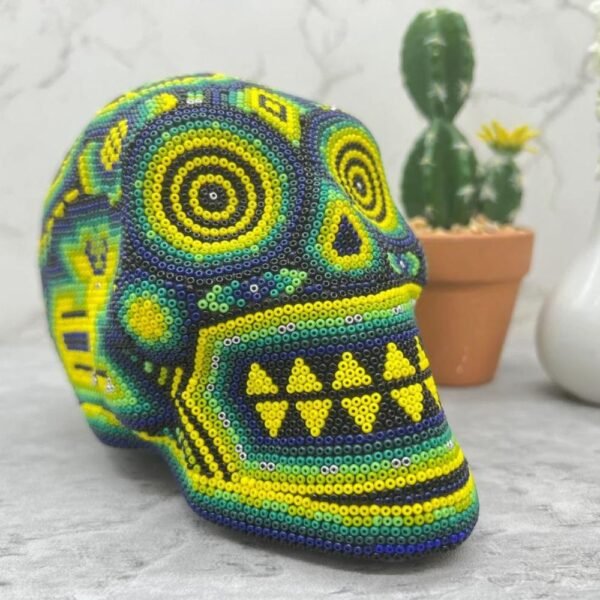 Human skull Huichol Sculpture Of Mexican Folk Art, Skull head Wixarika As A Mexican Decorative Figure , Made Of Wood And Beads