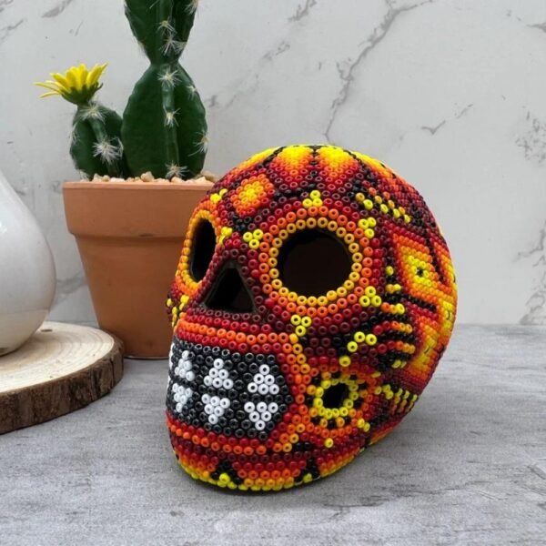 Human skull Huichol Sculpture Of Mexican Folk Art, Skull head Wixarika As A Mexican Decorative Figure , Made Of Wood And Beads