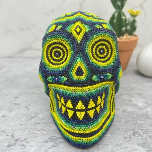 Human skull Huichol Sculpture Of Mexican Folk Art, Skull head Wixarika As A Mexican Decorative Figure , Made Of Wood And Beads